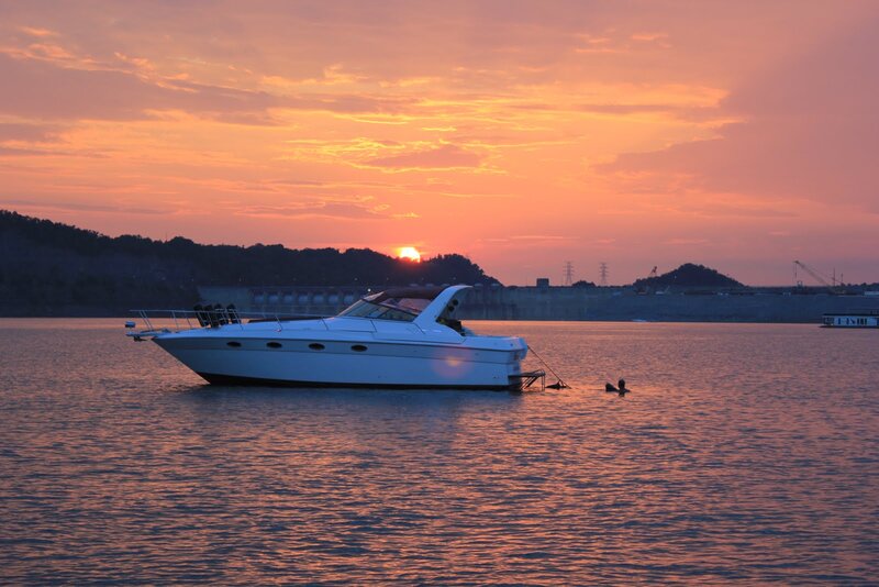 White Motorboat on Water — Orange