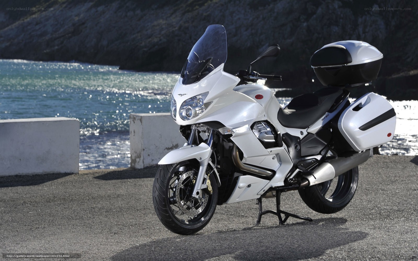 White motorcycle by the sea