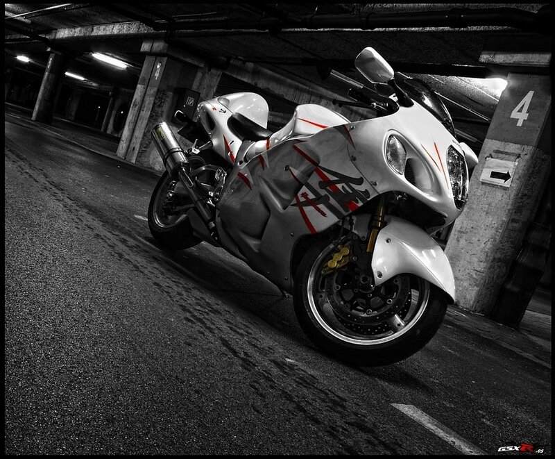 White motorcycle in parking garage