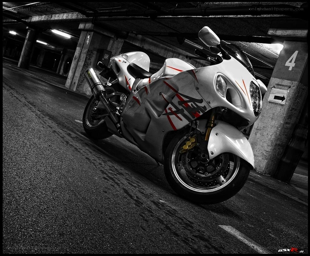 White motorcycle in parking garage