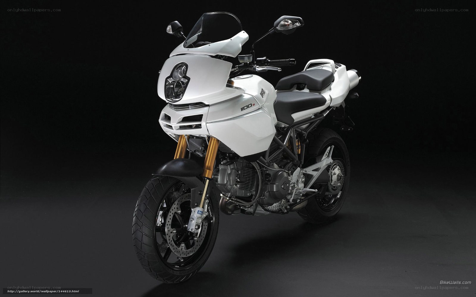 white motorcycle on black background