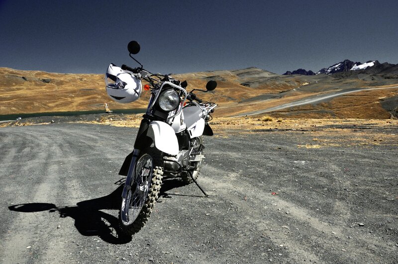 White motorcycle on gravel road