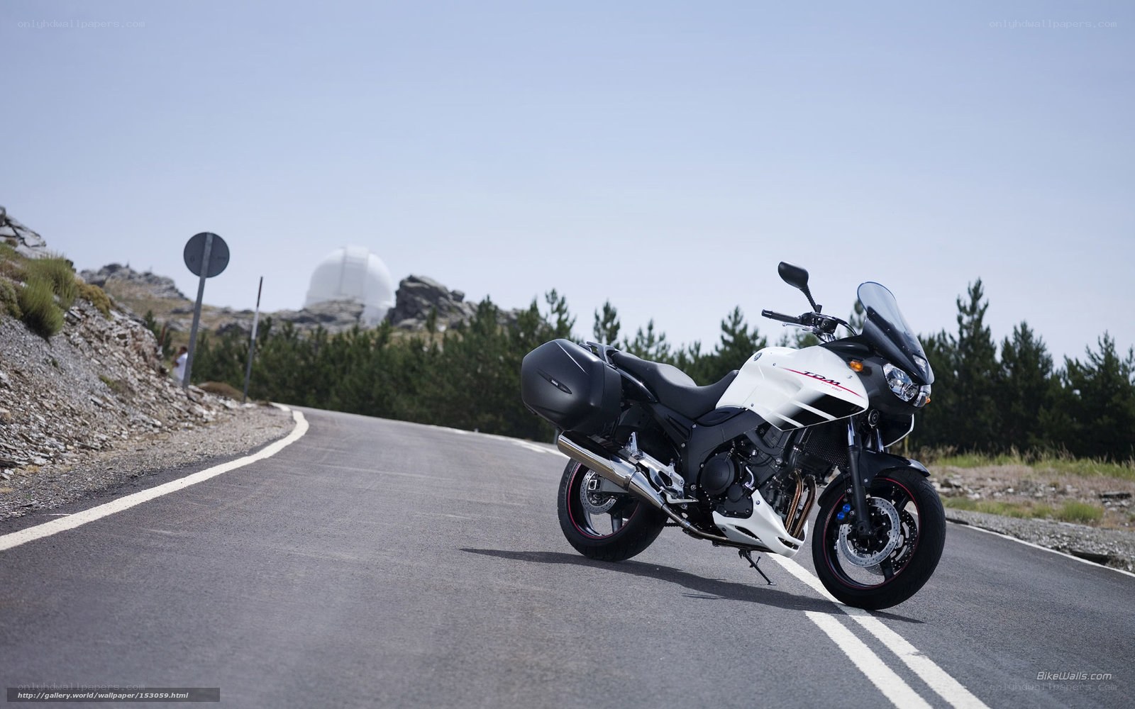 White motorcycle on mountain road