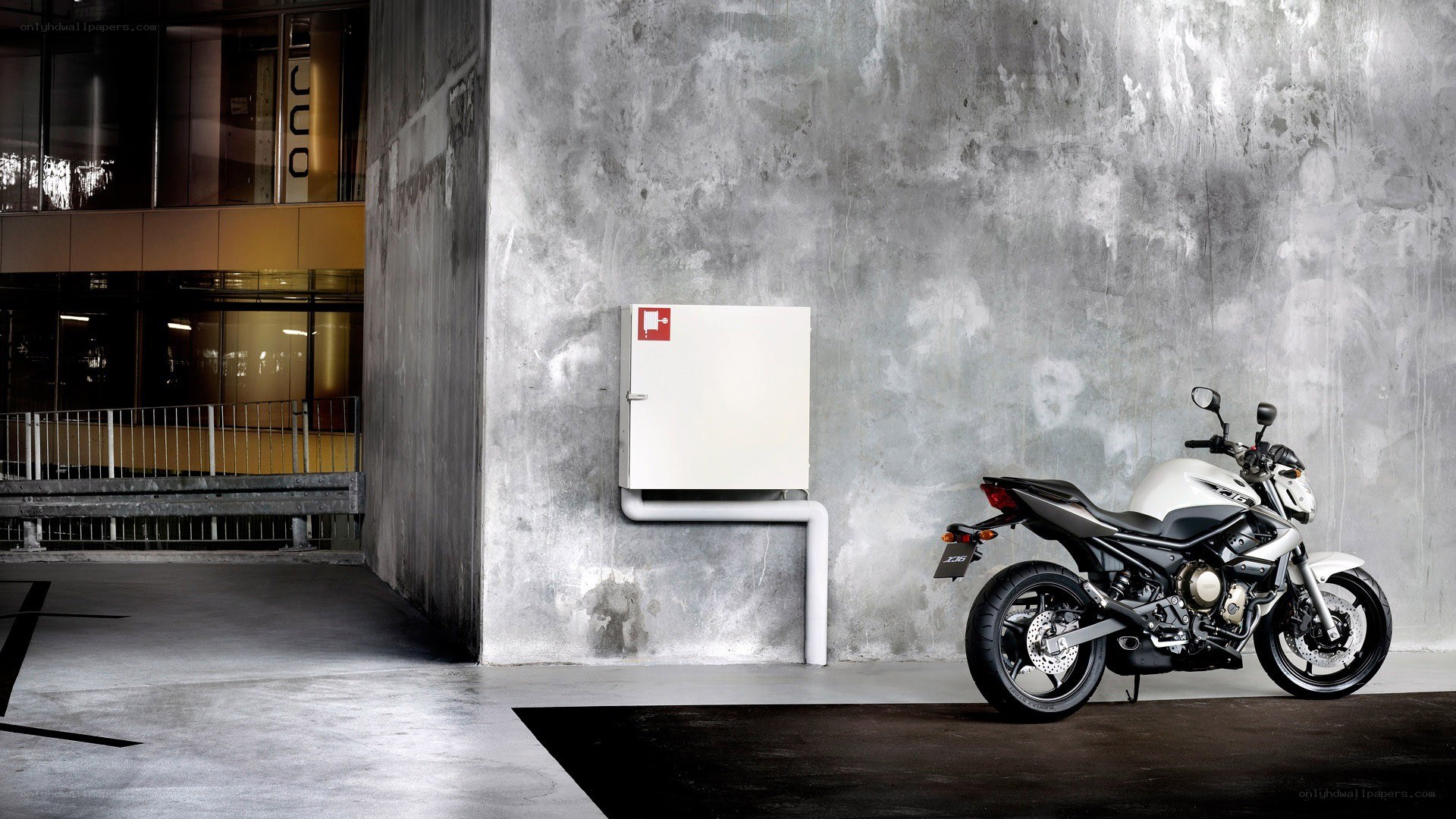 White motorcycle parked in garage