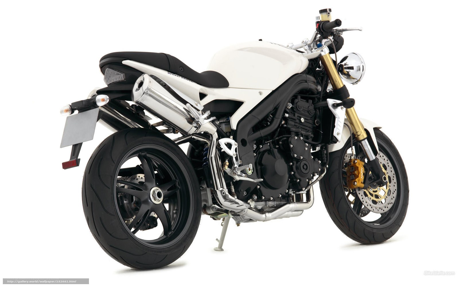 white motorcycle with chrome exhaust
