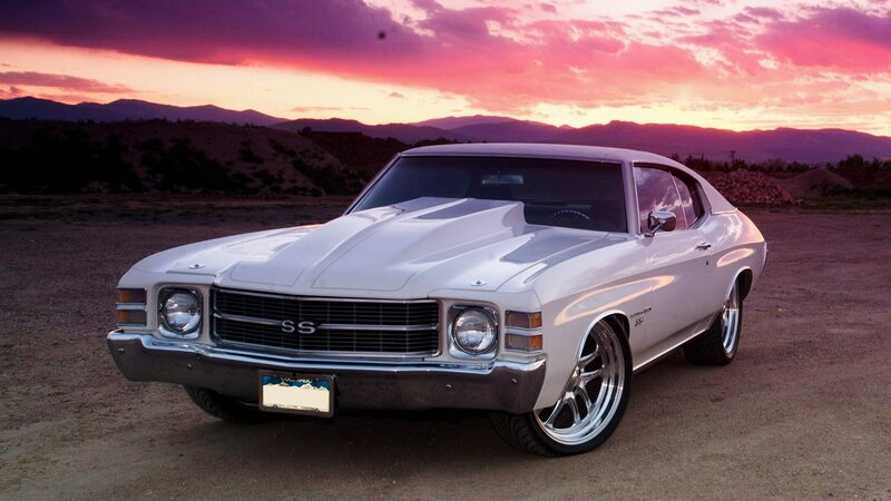 White muscle car at sunset