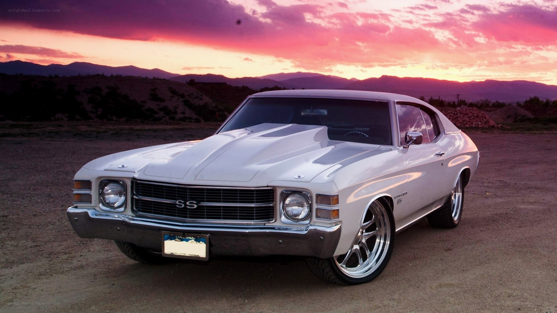 White muscle car at sunset