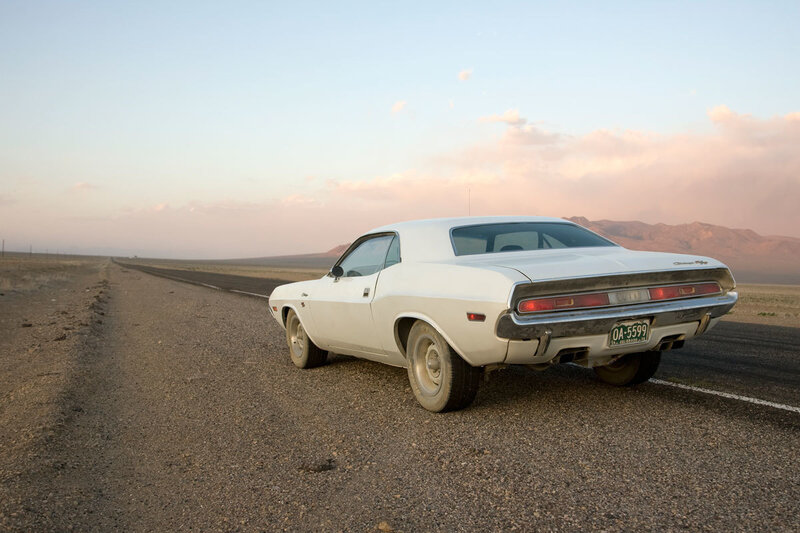 White Muscle Car on Road — Serene