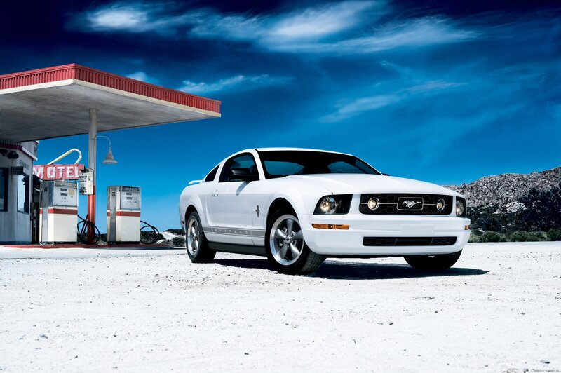 White Mustang at a desert gas station