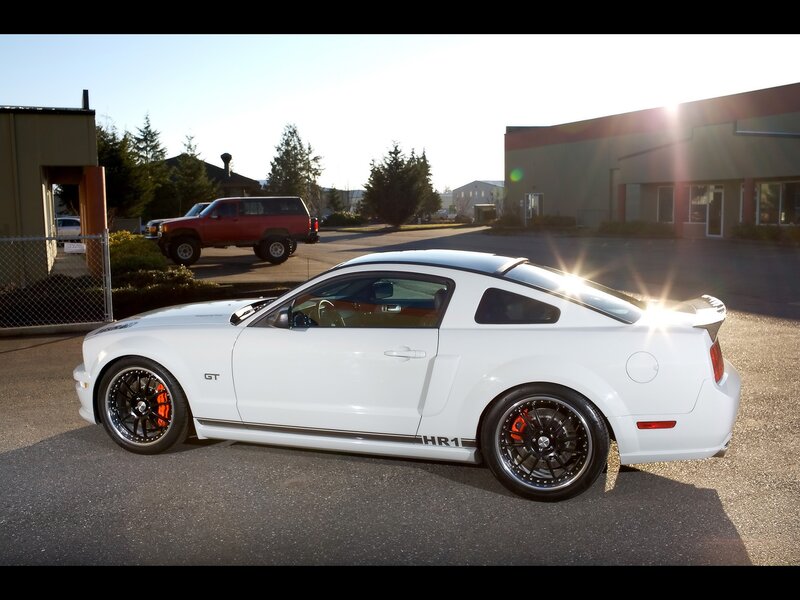 white mustang gt on asphalt