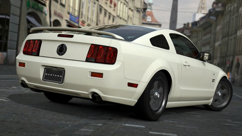 white mustang gt on city street