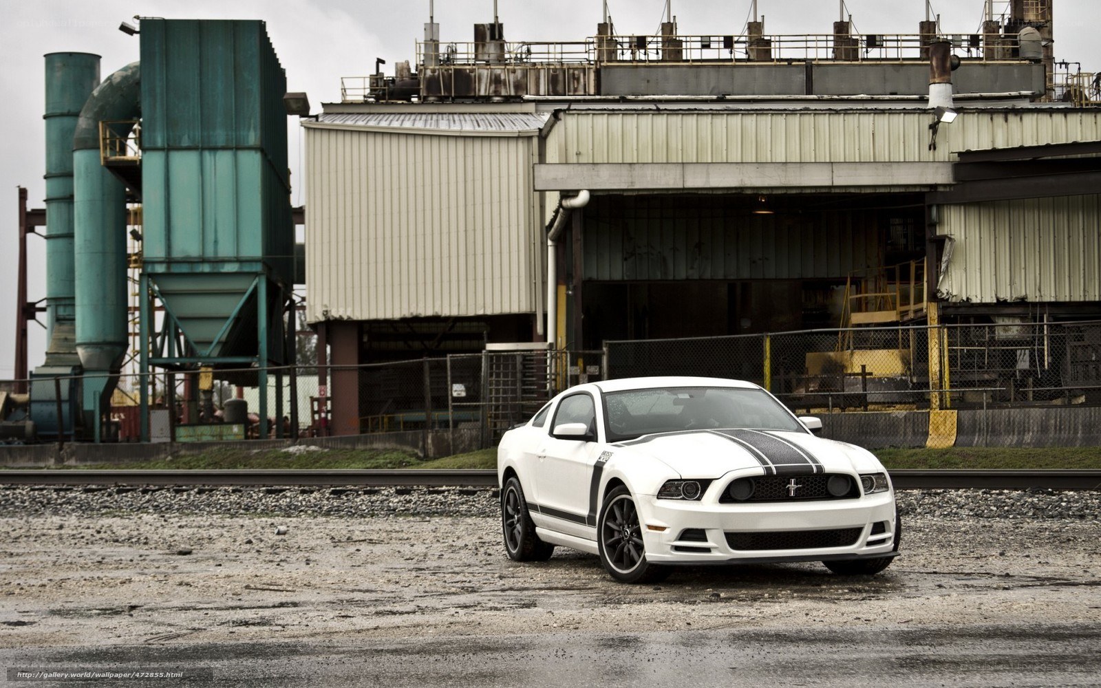 White Mustang in industrial setting