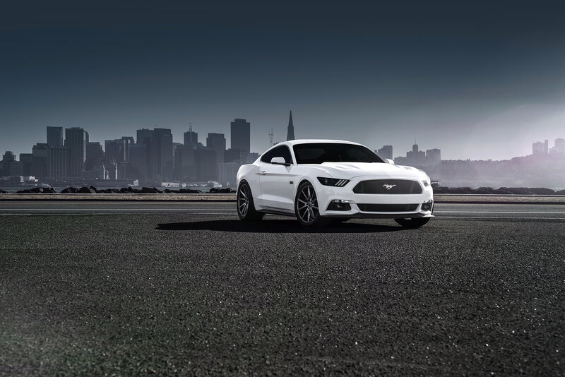 White Mustang on city road