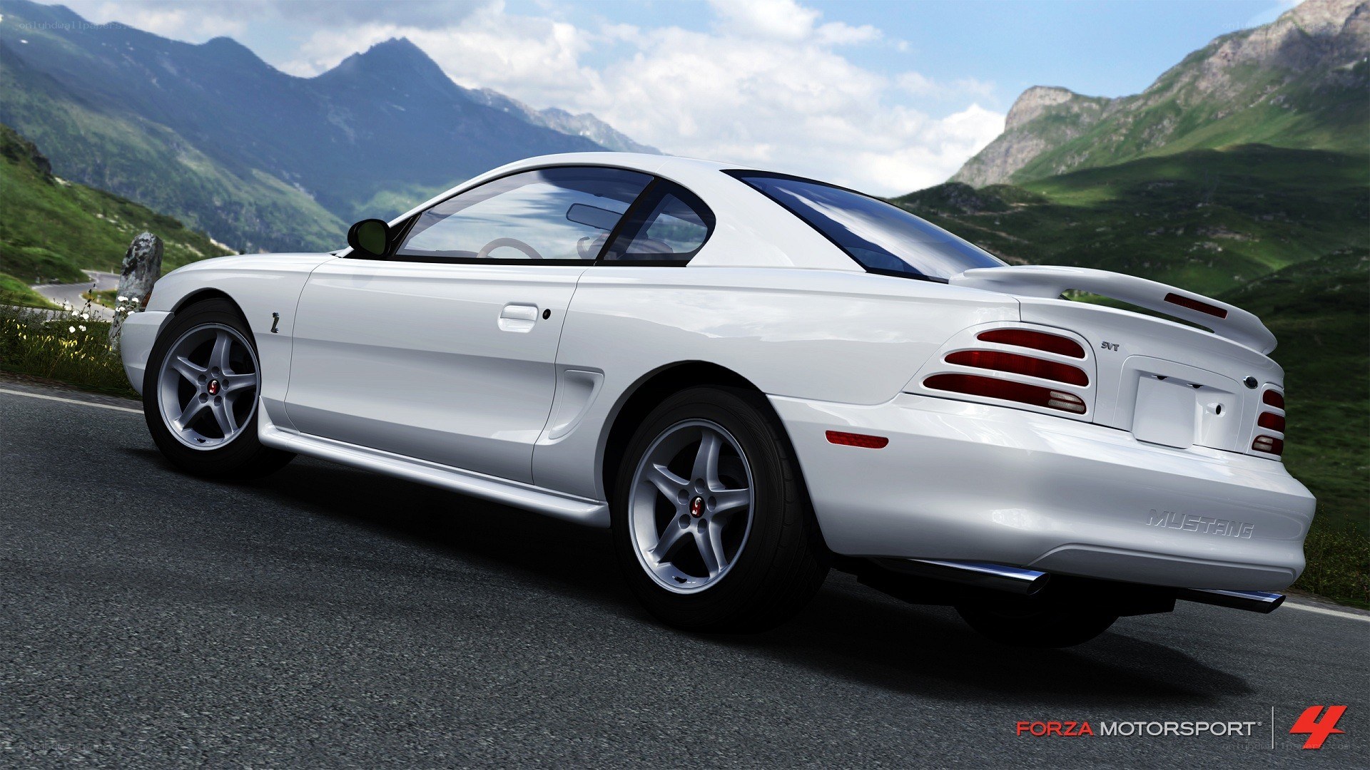white mustang on mountain road