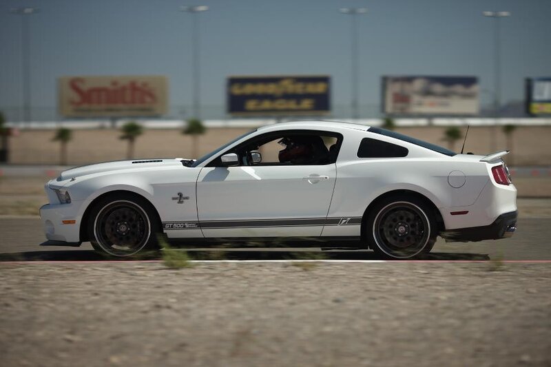 white mustang on racetrack