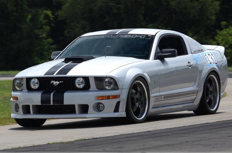 white mustang on racetrack