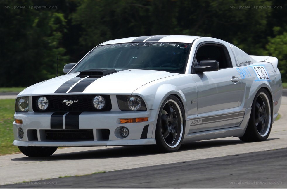 white mustang on racetrack
