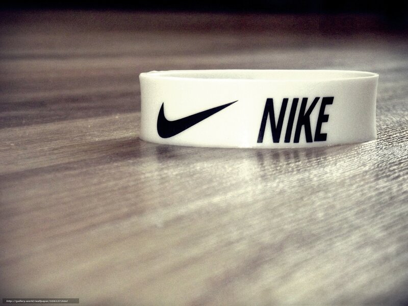 white nike wristband on wood