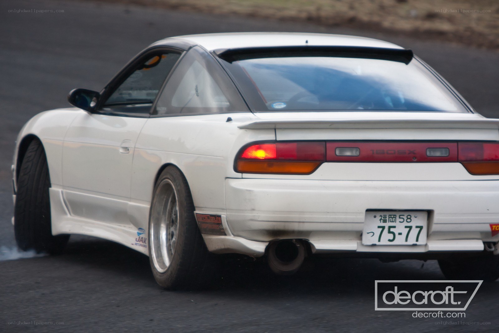 white nissan 180sx drifting