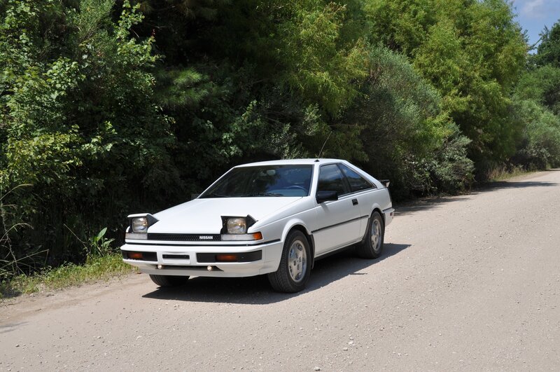white nissan 180sx on a road