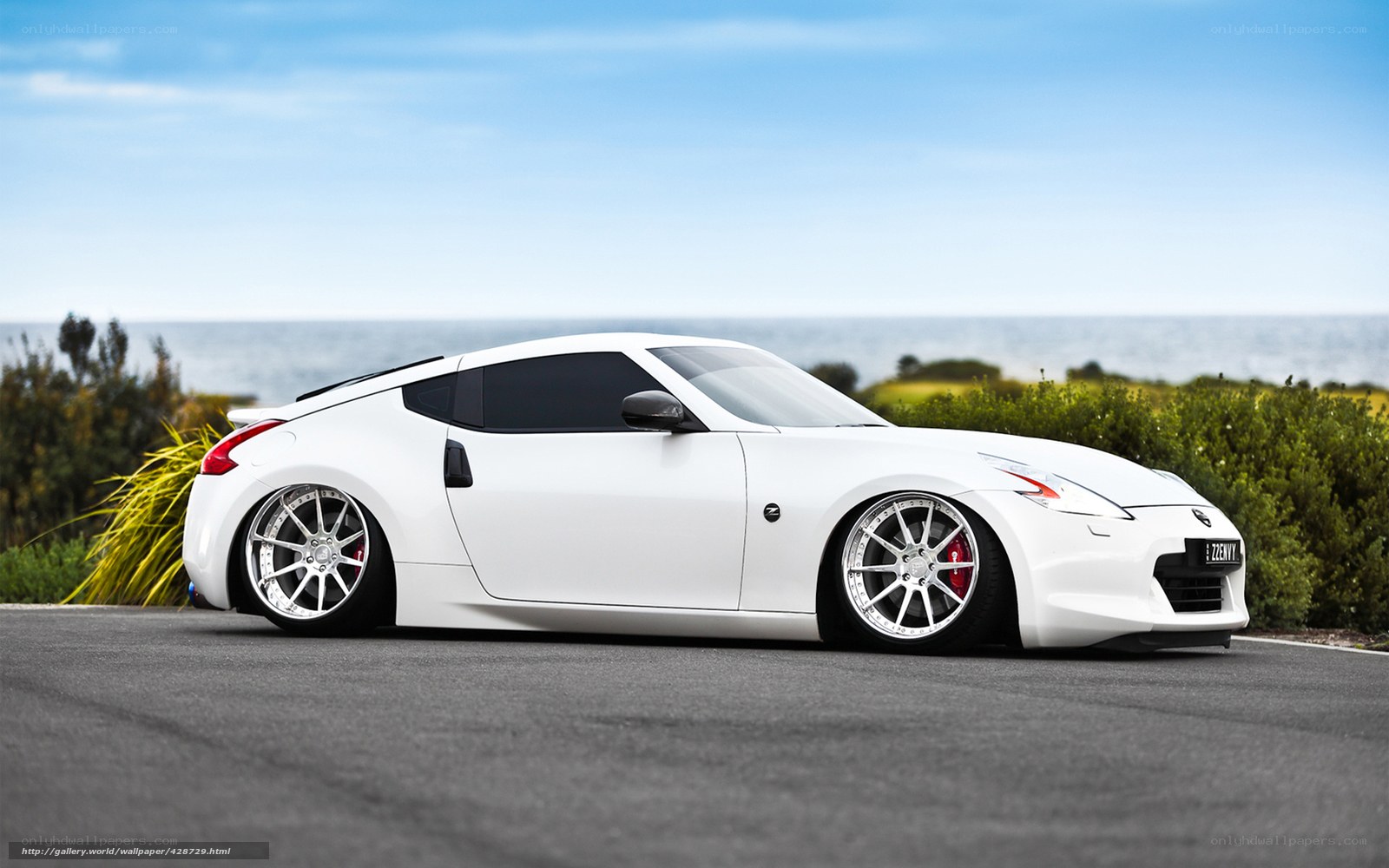 White Nissan 370Z by the coast