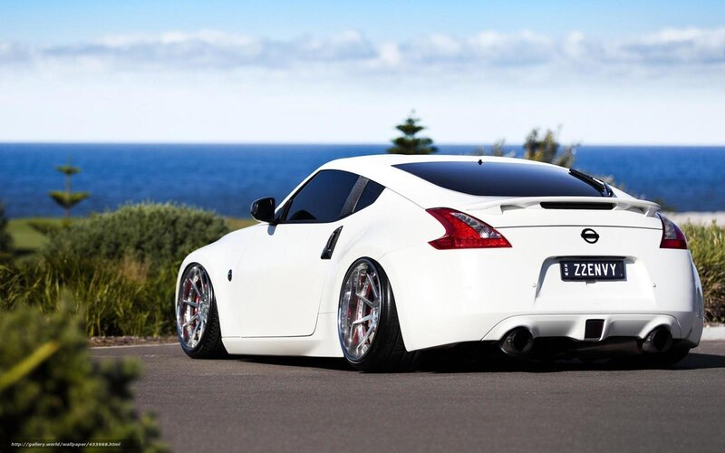 White Nissan 370Z by the ocean