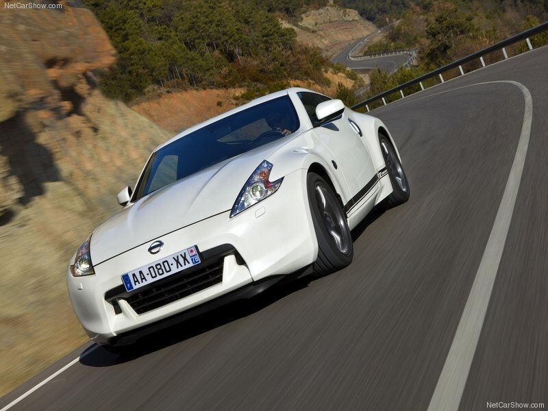 white nissan 370z on winding road