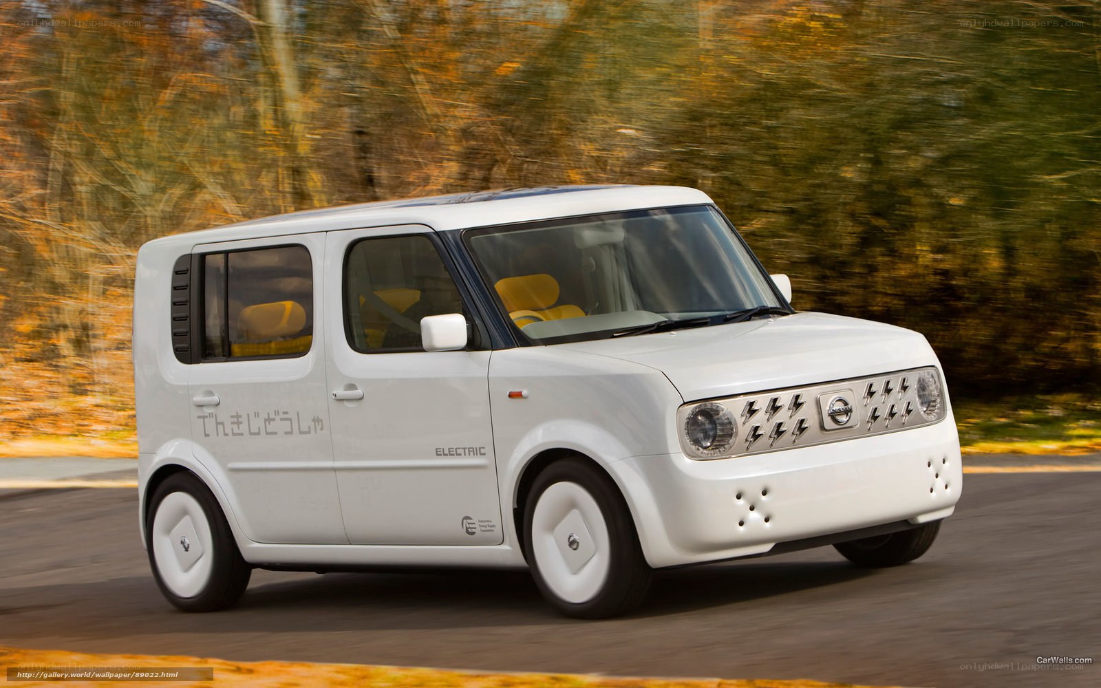 White Nissan Cube Electric in motion