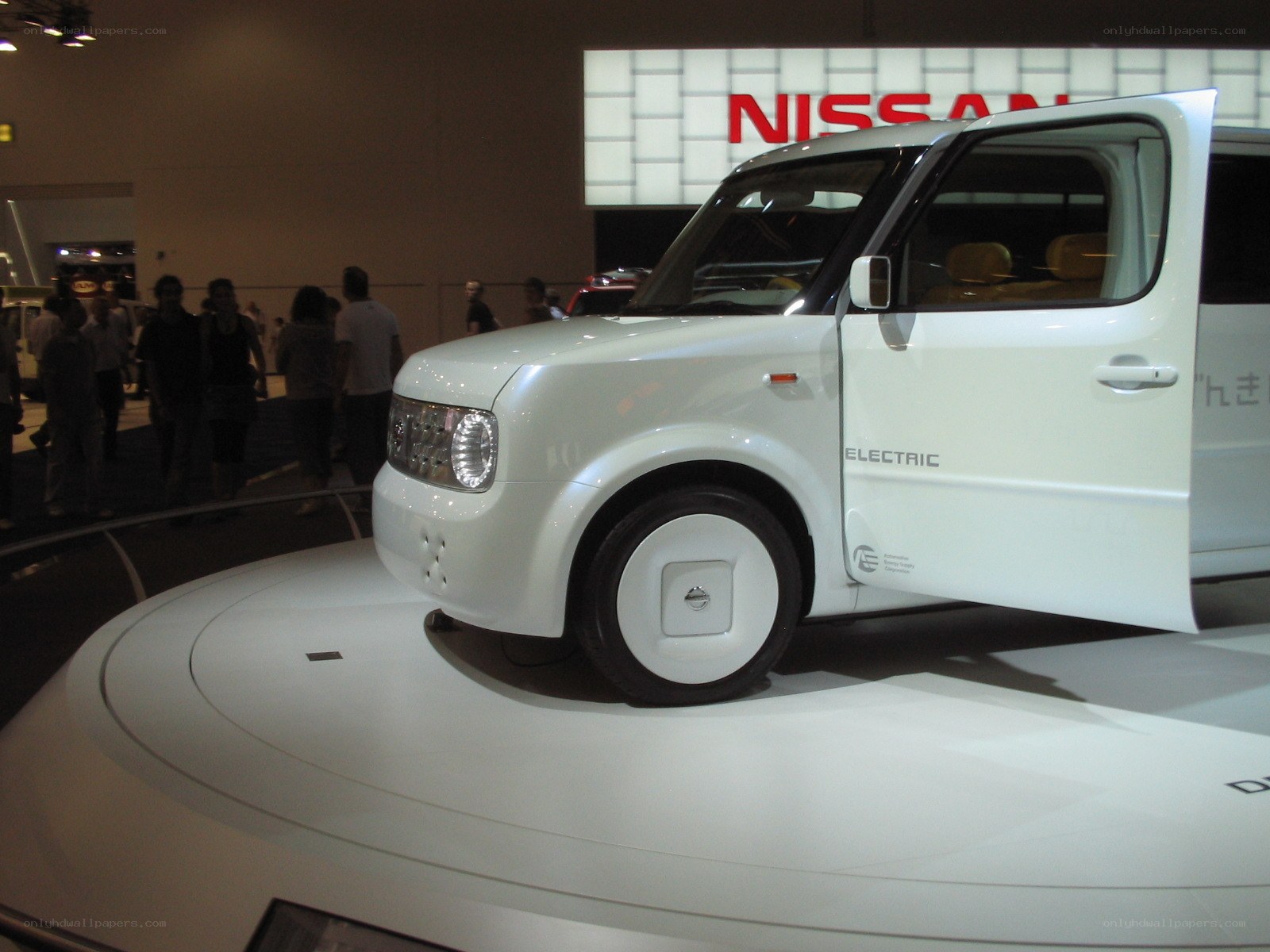 White Nissan electric car on display