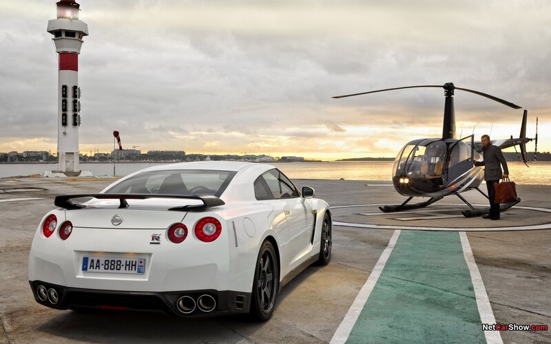 White Nissan GT-R and helicopter