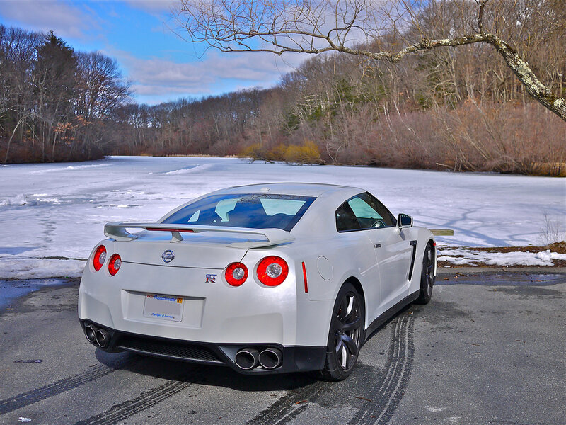 White Nissan GT-R by a frozen lake