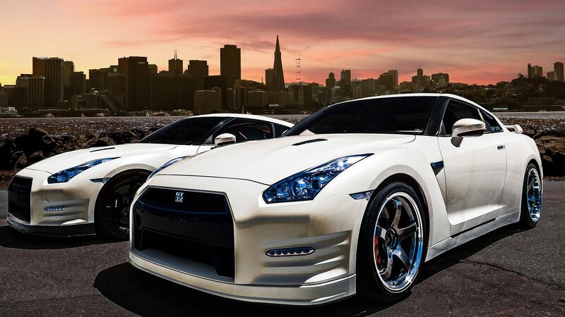 White Nissan GT-R cars at sunset