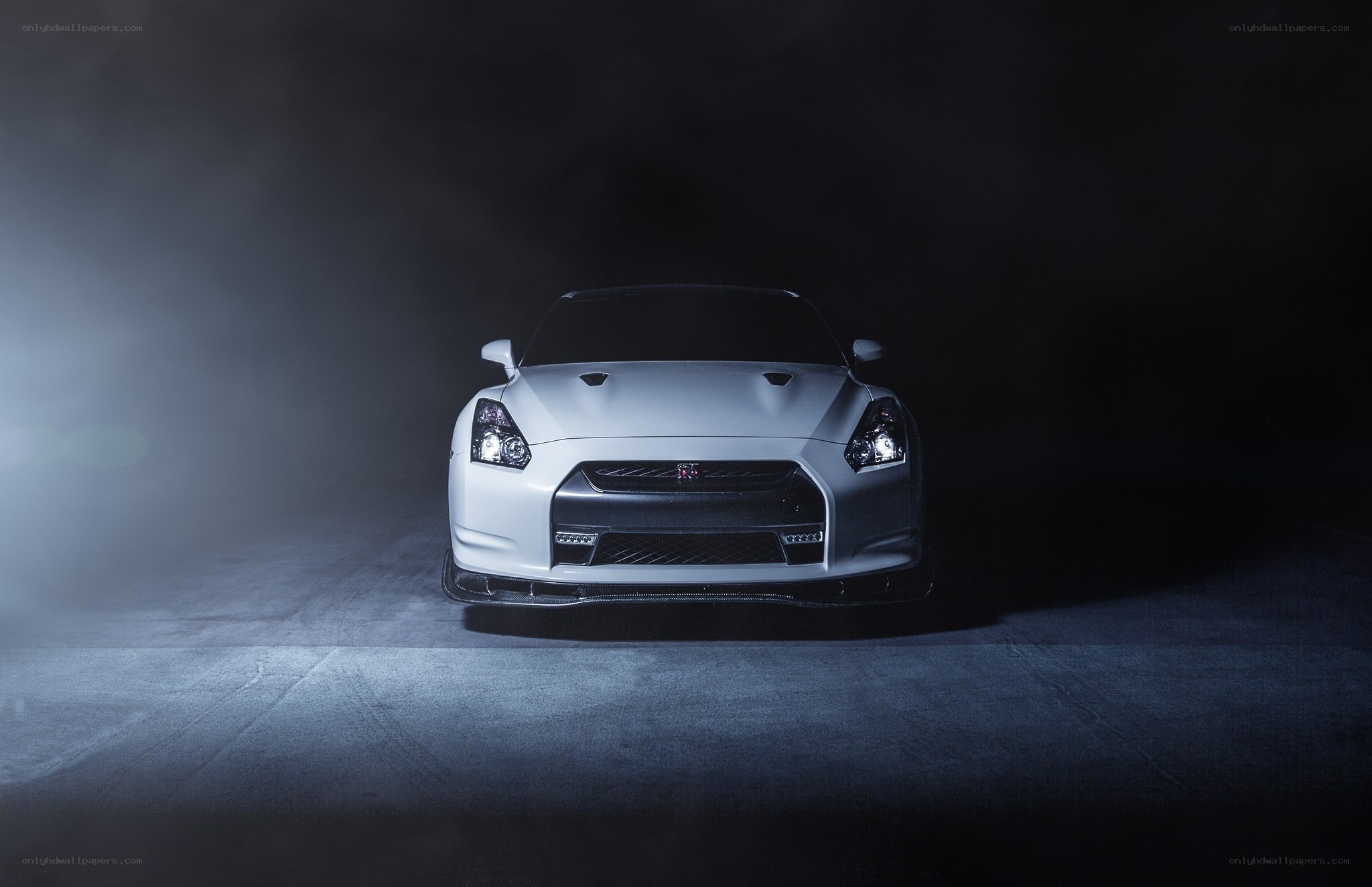 white nissan gt-r in dark studio