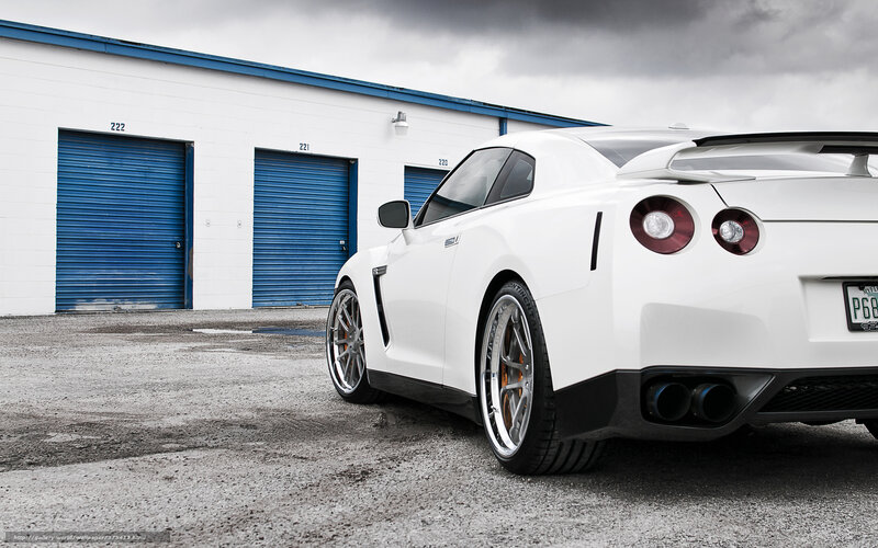 White Nissan GT-R in front of garage