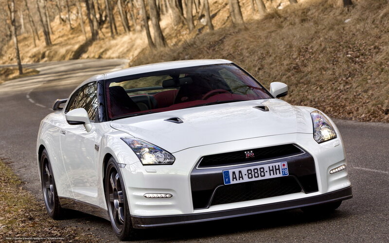 White Nissan GT-R on a forest road
