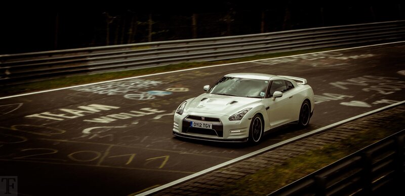 White Nissan GT-R on a racetrack