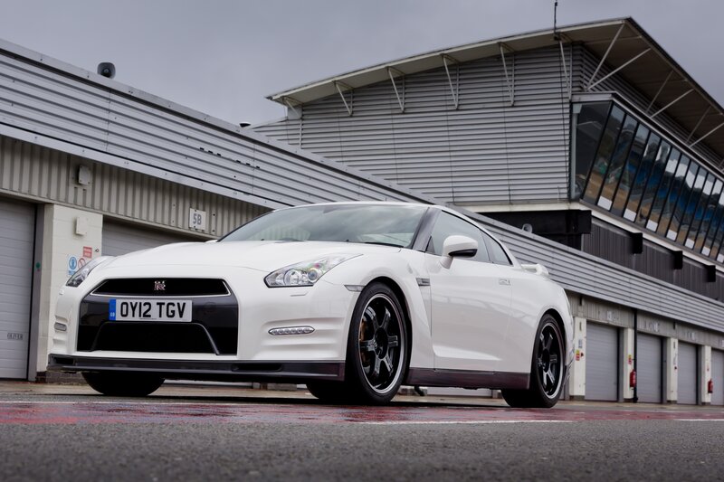 White Nissan GT-R on a racetrack