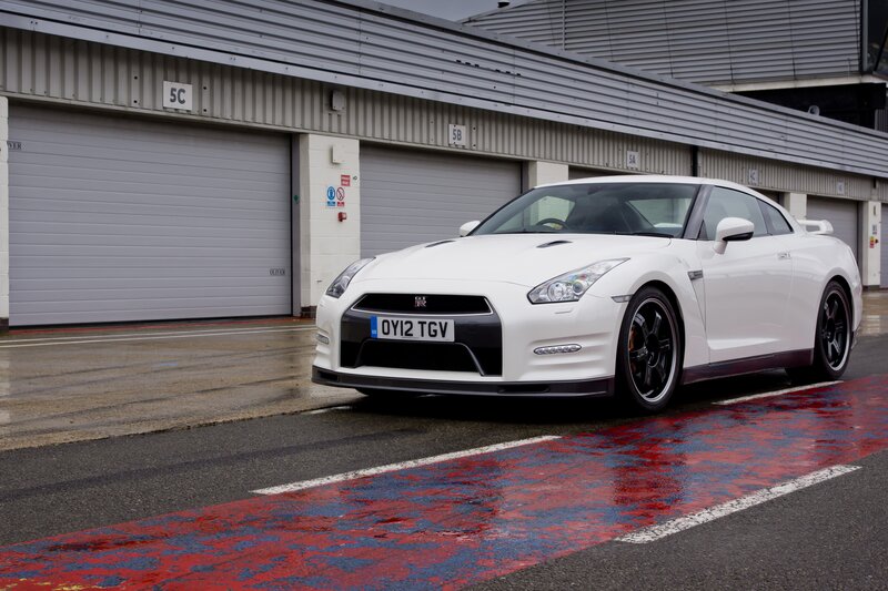 White Nissan GT-R on a racetrack