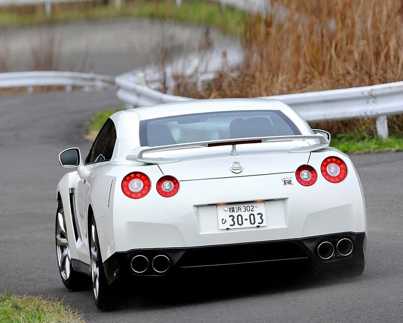 White Nissan GT-R on a winding road