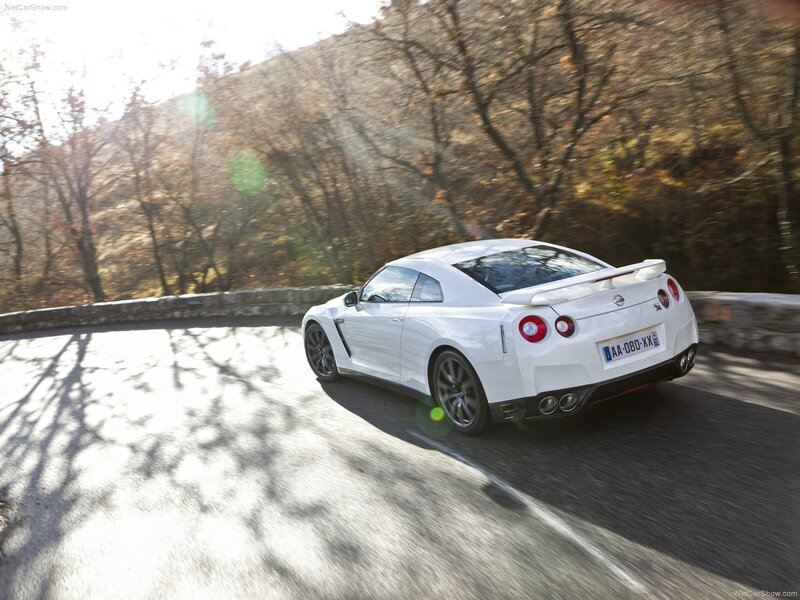 White Nissan GT-R on a winding road