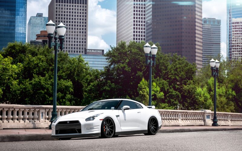 White Nissan GT-R on city bridge
