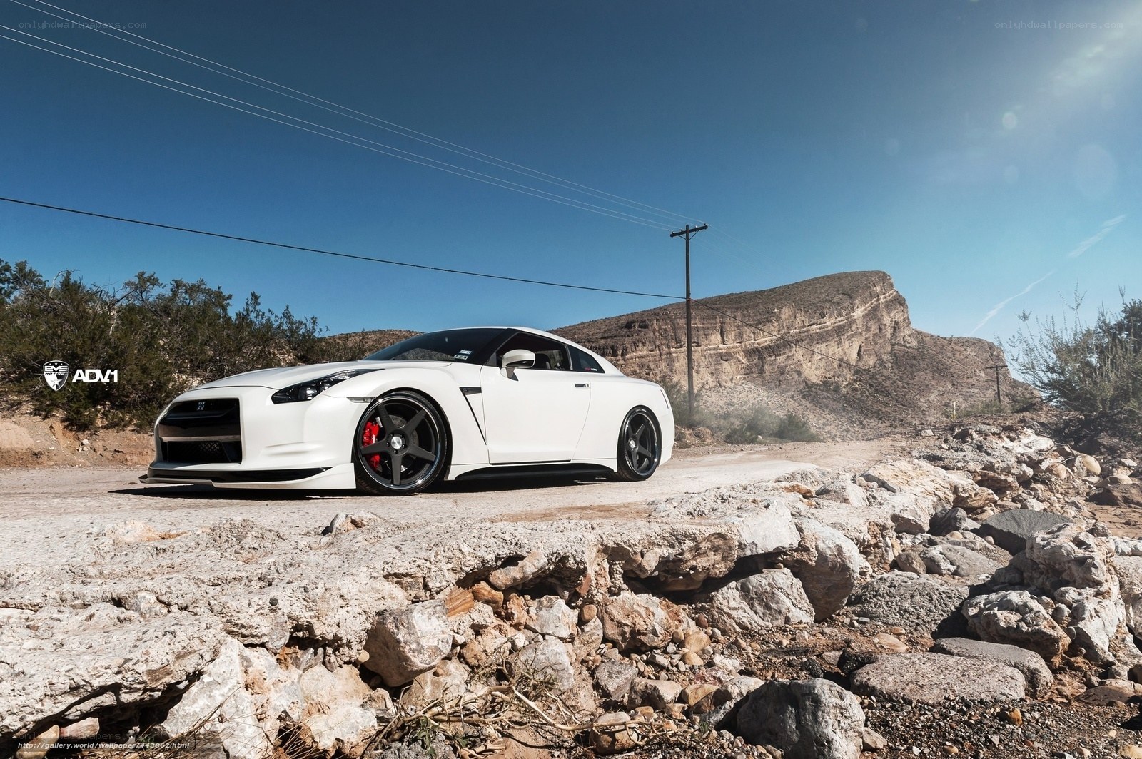 White Nissan GT-R on desert road