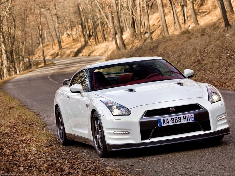 white nissan gt-r on forest road