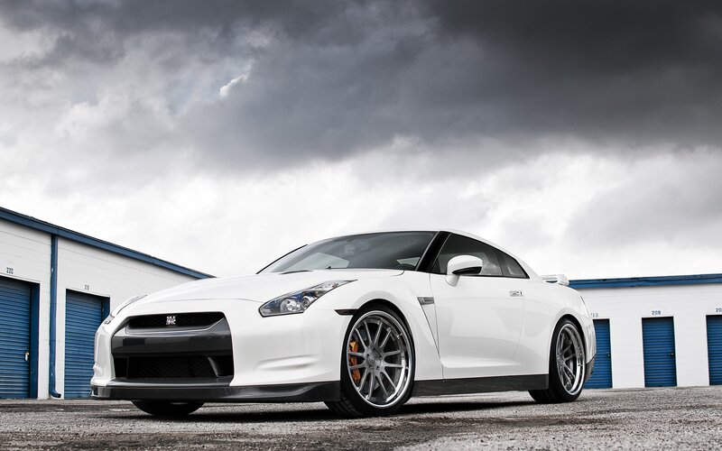 White Nissan GT-R on gravel lot