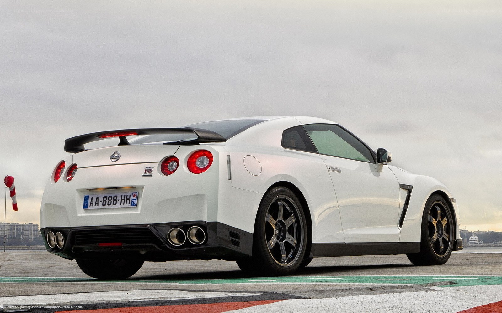 White Nissan GT-R on racetrack