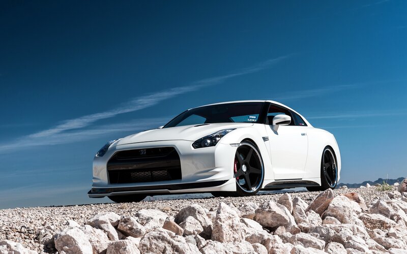 White Nissan GT-R on rocky terrain