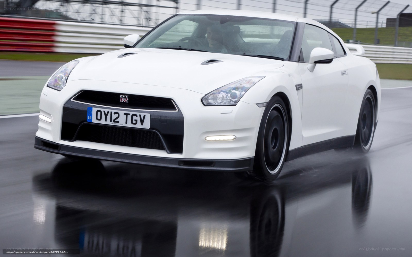 white nissan gt-r on wet track