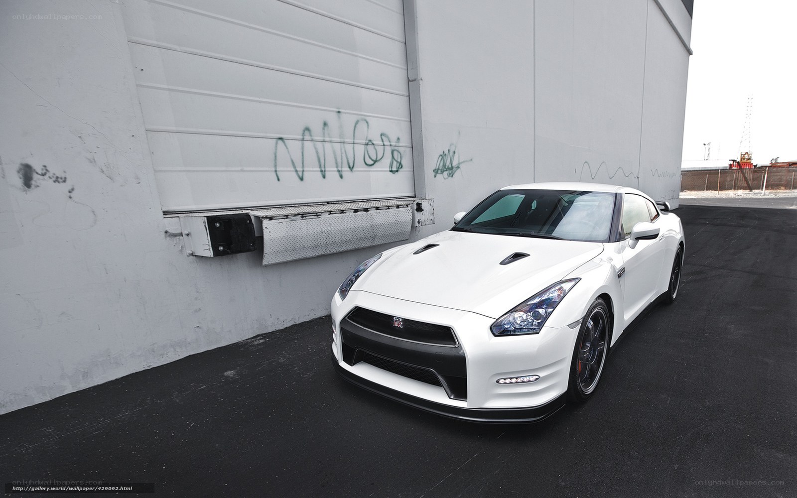 White Nissan GT-R parked outside