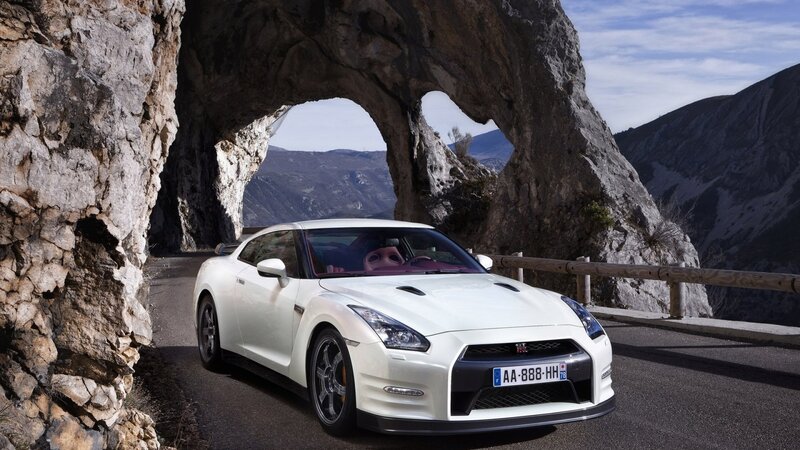 White Nissan GT-R under rock arch