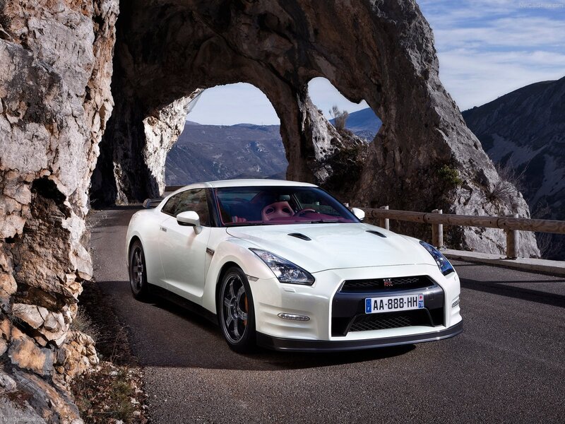 White Nissan GT-R under rock arch